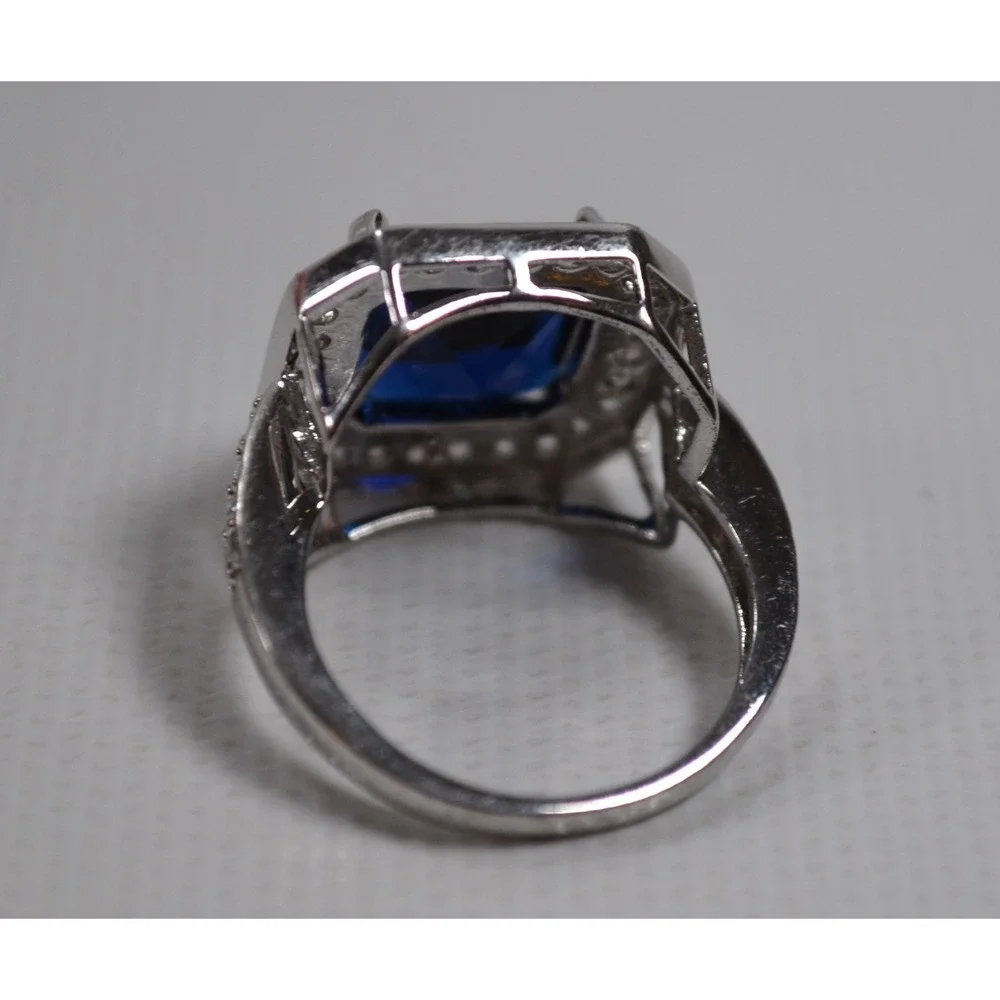 Silver Tone Ring Sz 6.75 w/ Large Blue Setting Sounded By Tiny Clear Rhinestones